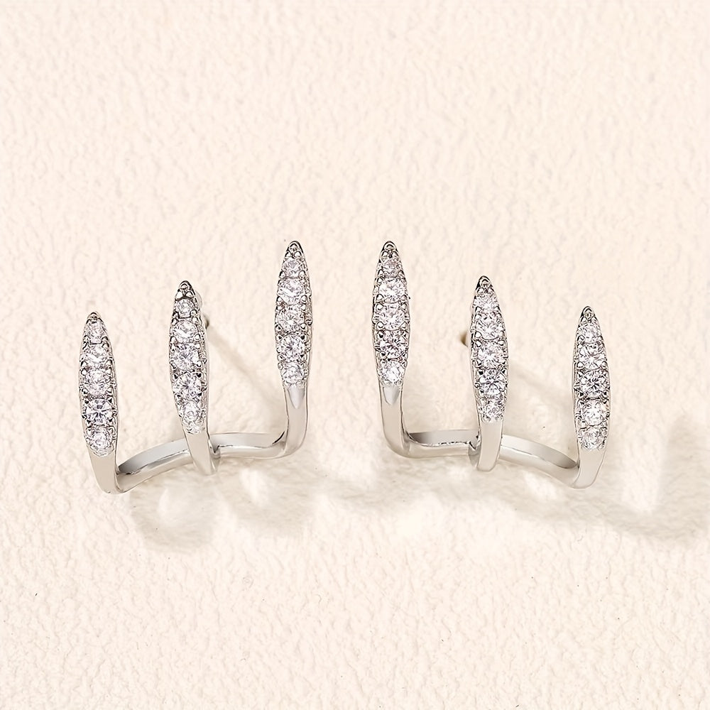 Elegantne naušnice sa tri kandže ukrašene draguljima