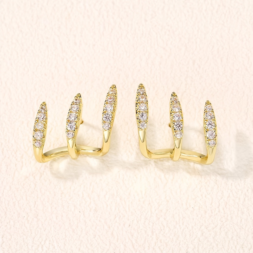 Elegantne naušnice sa tri kandže ukrašene draguljima