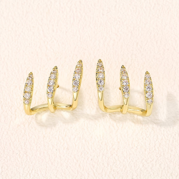 Elegantne naušnice sa tri kandže ukrašene draguljima