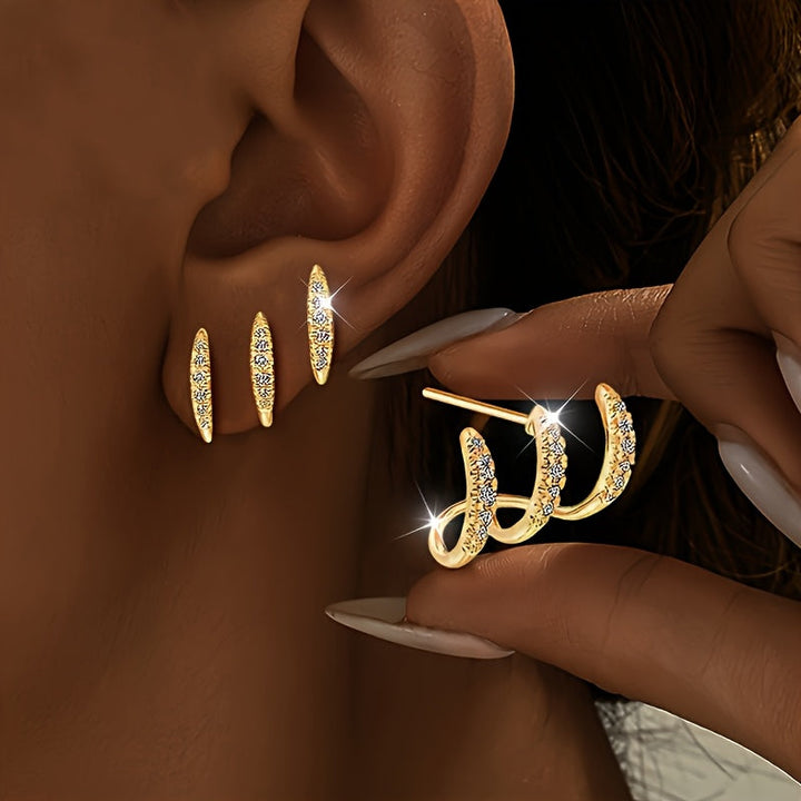 Elegantne naušnice sa tri kandže ukrašene draguljima